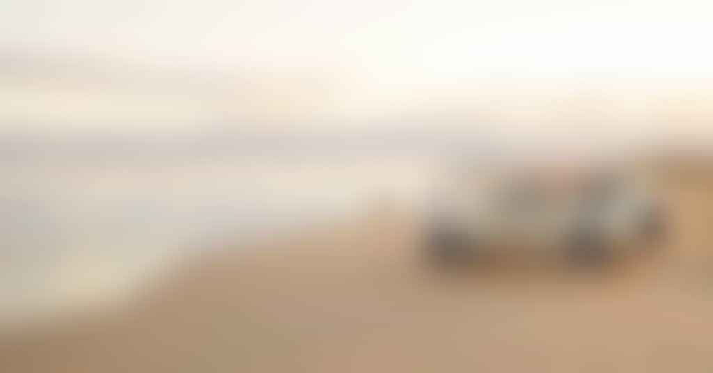 Stockton Beach Credit Tourism Australia Nov 2022 Car couple of Stockton beach632077 19 1