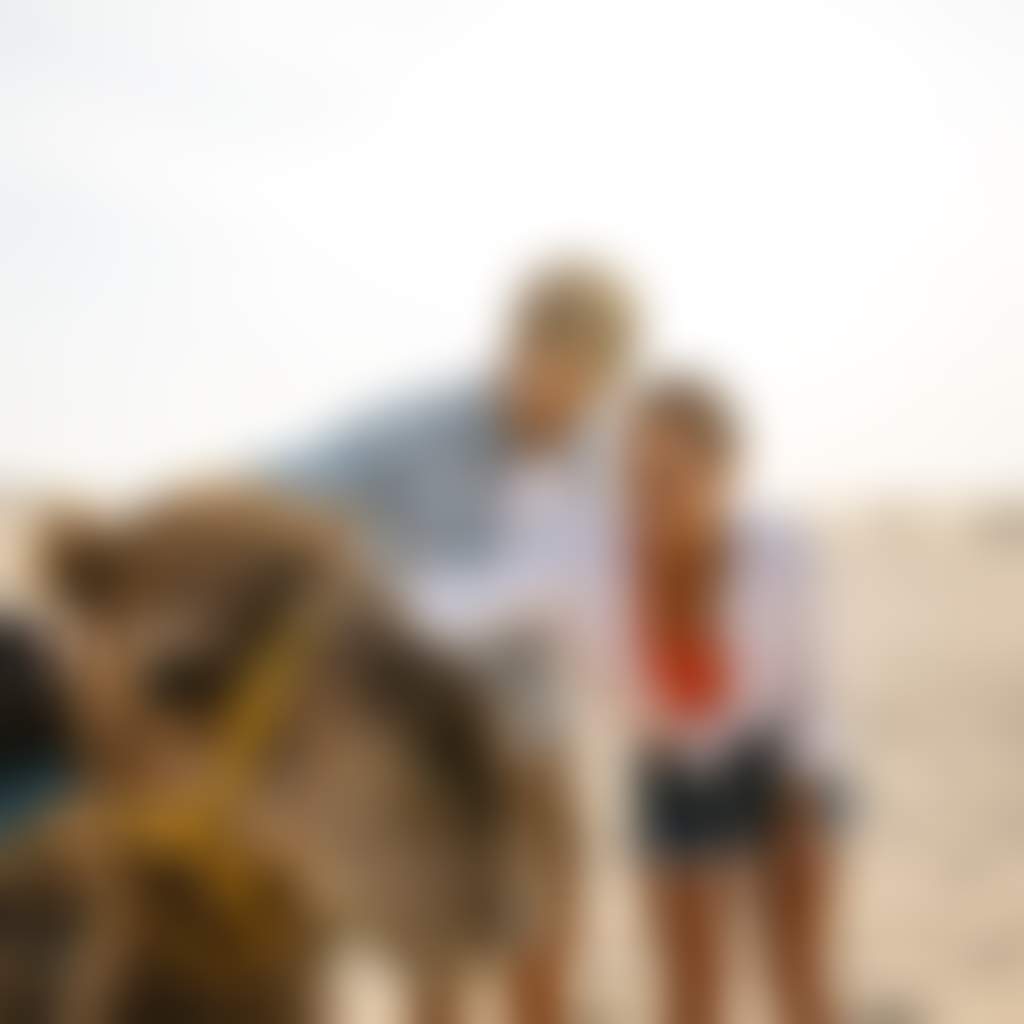 Couple with a camel sand dunes anna bay